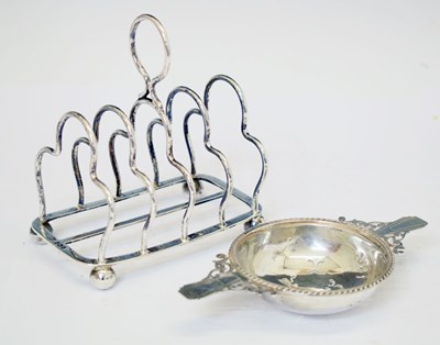 Lot 212 - Edward VII silver toast rack, and an Edward VIII silver tea strainer