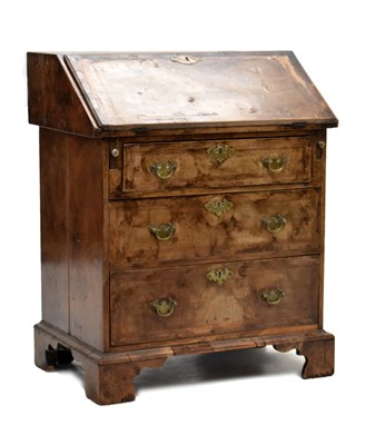 Lot 717 - Small early 18th century walnut, crossbanded and featherbanded bureau