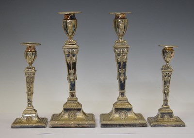 Lot 375 - Set of four silver-plated candlesticks in the neo-classical manner