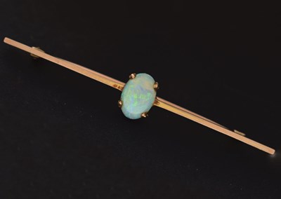 Lot 69 - Opal cabochon 9ct gold bar brooch