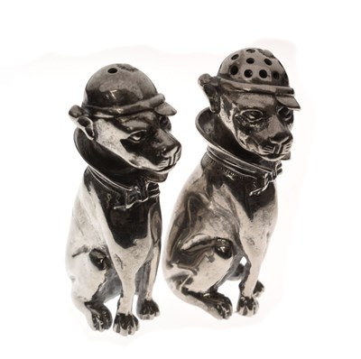 Lot 149 - Pair of 20th century silver plated novelty salt and pepper shakers in the form of seated dogs