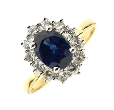 Lot 16 - Garrard & Co sapphire and diamond 18ct yellow and white gold set cluster ring