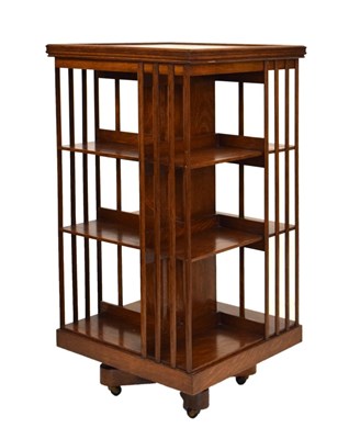 Lot 511 - Early 20th Century golden oak revolving bookcase