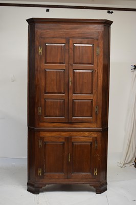 Lot 745 - George III mahogany corner cupboard