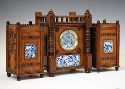 Lot 479 - J. W. Benson - late Victorian Aesthetic Movement tile-inset oak three-piece clock garniture