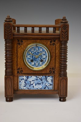 Lot 479 - J. W. Benson - late Victorian Aesthetic Movement tile-inset oak three-piece clock garniture