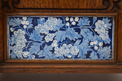 Lot 479 - J. W. Benson - late Victorian Aesthetic Movement tile-inset oak three-piece clock garniture