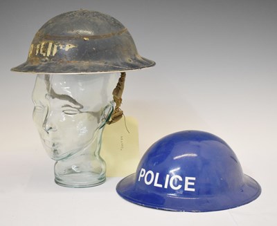 Lot 472 - World War II period 'Police' Brodie steel helmet and repainted example