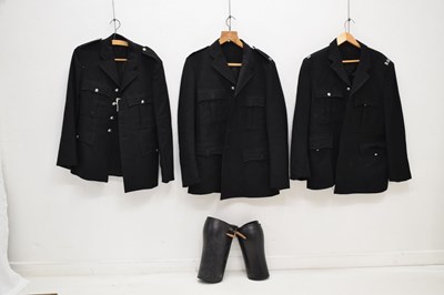 Lot 346 - Three police issue constable's uniform jackets together with two pairs of  black leather gaiters