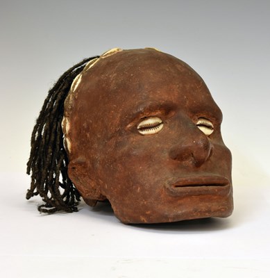 Lot 183 - Ethnographica: Sepik River (Papua New Guinea) clay and shell-mounted human skull