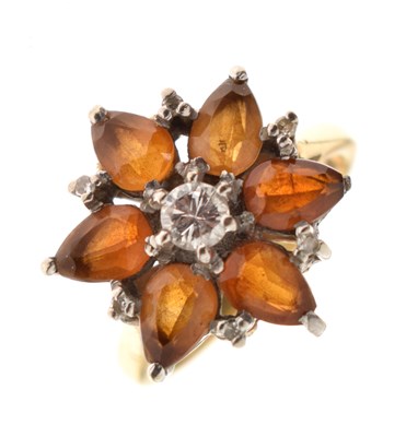 Lot 25 - Citrine-coloured stone and diamond flowerhead 18ct gold ring