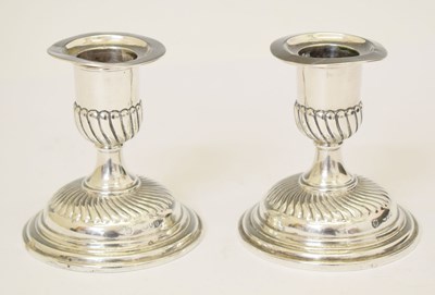 Lot 253 - Pair of Victorian silver short candlesticks