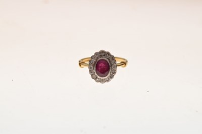 Lot 32 - 18ct gold, ruby and diamond cluster ring