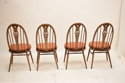 Lot 697 - Ercol - Set of four Windsor swan-back dining chairs and dining table