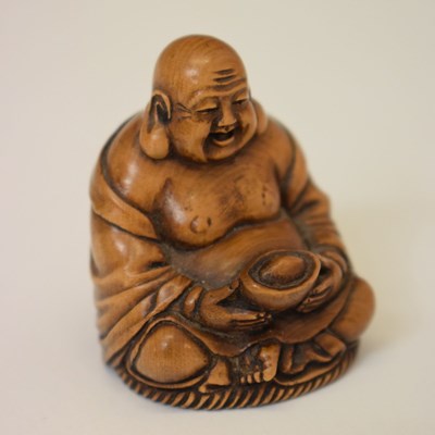 Lot 624 - Japanese early 20th century carved hardwood netsuke in the form of a seated Buddha