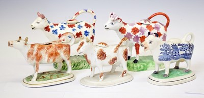 Lot 514 - Five Staffordshire cow creamers