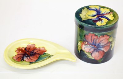 Lot 530 - Moorcroft Pottery - Hibiscus pattern lidded cylindrical jar and pin dish