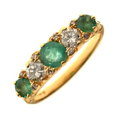 Lot 17 - Emerald and diamond 18ct yellow gold five stone ring