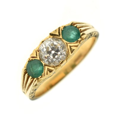 Lot 15 - Emerald and diamond 18ct gold three-stone ring