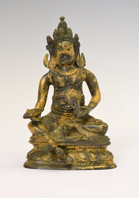 Lot 301 - Fine early Sino-Tibetan fire-gilt bronze figure of Jambhala