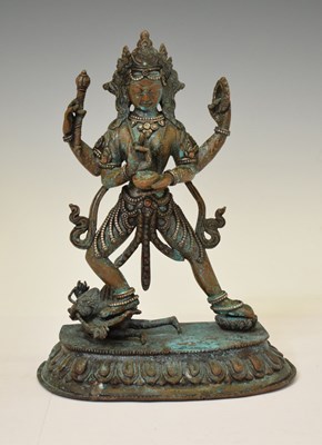 Lot 601 - Tibetan bronze figure of Shiva with Garuda