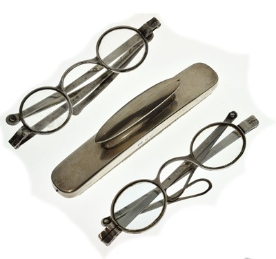 Lot 219 - Two pairs of Georgian silver spectacles, and a silver mounted nail buffer