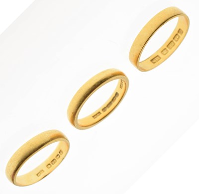 Lot 64 - Three 22ct gold wedding bands