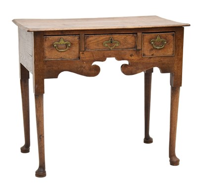 Lot 714 - George III oak lowboy