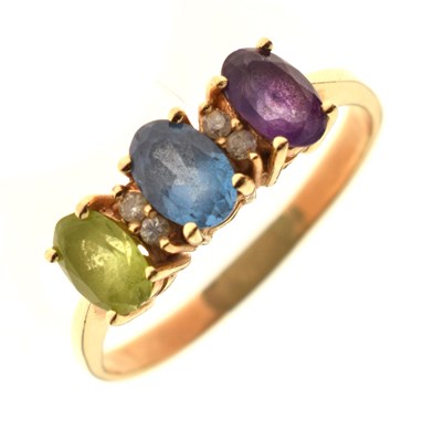 Lot 119 - Peridot, topaz, amethyst and diamond dress ring