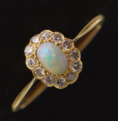 Lot 37 - Opal and diamond 18ct gold cluster ring