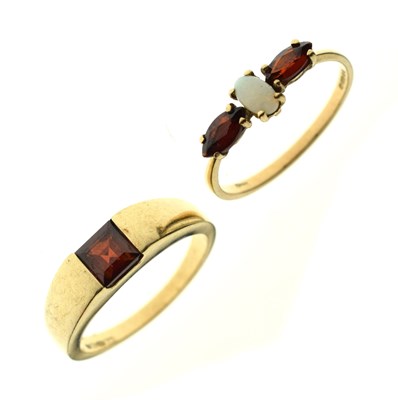 Lot 116 - Two 9ct gold garnet dress rings