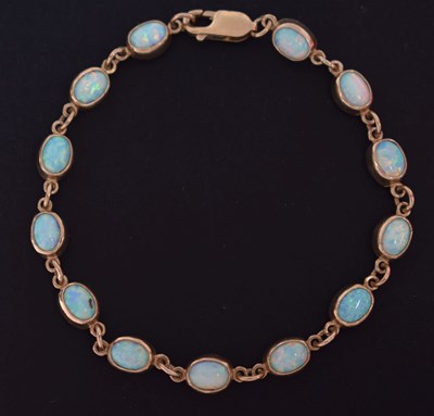 Lot 129 - Opal cabochon 9ct gold bracelet