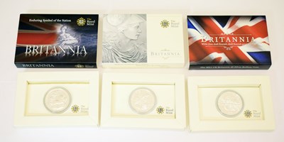 Lot 280 - Three Elizabeth II silver Britannia coins with presentation cases