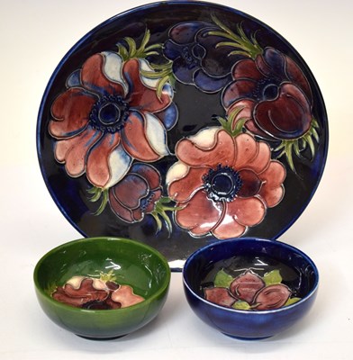 Lot 596 - Moorcroft Pottery - Anemone pattern shallow bowl and two others