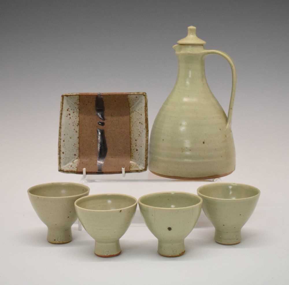 Lot 354 - Leach Pottery mead jug and four cups and Janet Leach dish