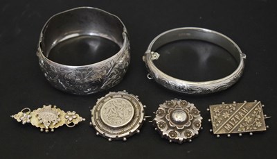 Lot 155 - Small group of silver and unmarked white metal jewellery including two antique silver bangles