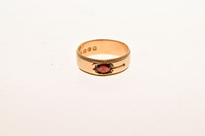 Lot 23 - 18ct gold band set garnet-coloured stone, size O, 5.3g gross approx