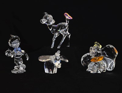 Lot 568 - Three Swarovski Crystal Disney Elements figures and a Swarovski Crystal Dumbo