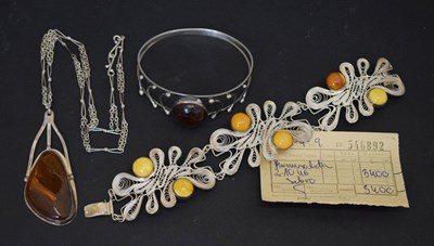 Lot 159 - Baltic amber bangle and pendant