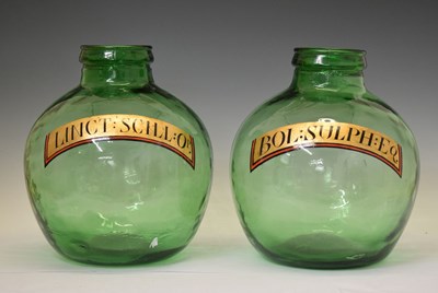 Lot 590 - Pair of reproduction green glass apothecary bottles / carboys