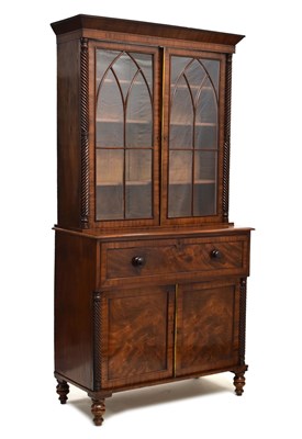 Lot 487 - Early 19th century figured mahogany secretaire bookcase