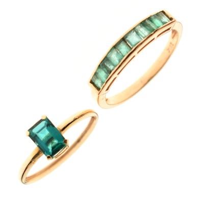 Lot 45 - Half eternity ring, the baguette cut emeralds channel set