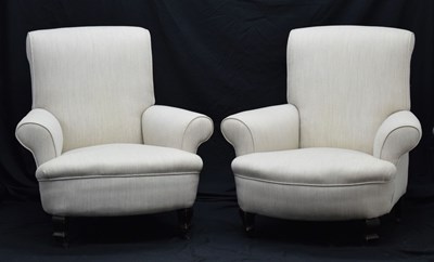 Lot 758 - Pair of early 20th century scroll back arm chairs in cream upholstery