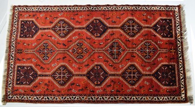 Lot 678 - Middle Eastern style red ground wool rug