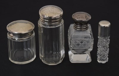 Lot 310 - Four silver topped cut glass dressing table jars, scent bottle, etc