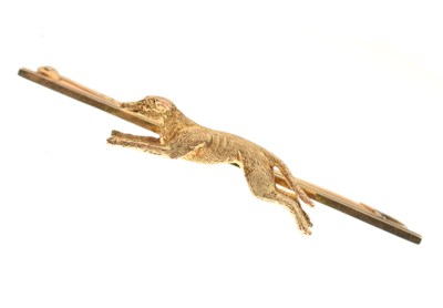 Lot 311 - 9ct gold bar brooch with a running greyhound to the centre