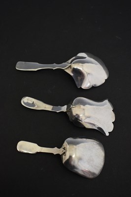 Lot 231 - Two Georgian silver shovel caddy spoons,  together with a later Victorian example