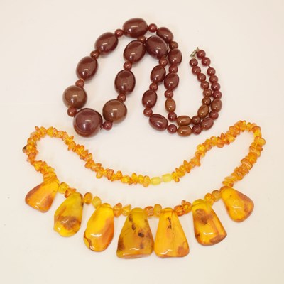 Lot 127 - 'Cherry amber' bakelite bead necklace and a Baltic amber necklace