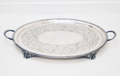 Lot 425 - Late Victorian silver plated tray with twin handles and engraved floral decoration