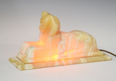 Lot 411 - Egyptian onyx lamp in the form of a reclining sphinx